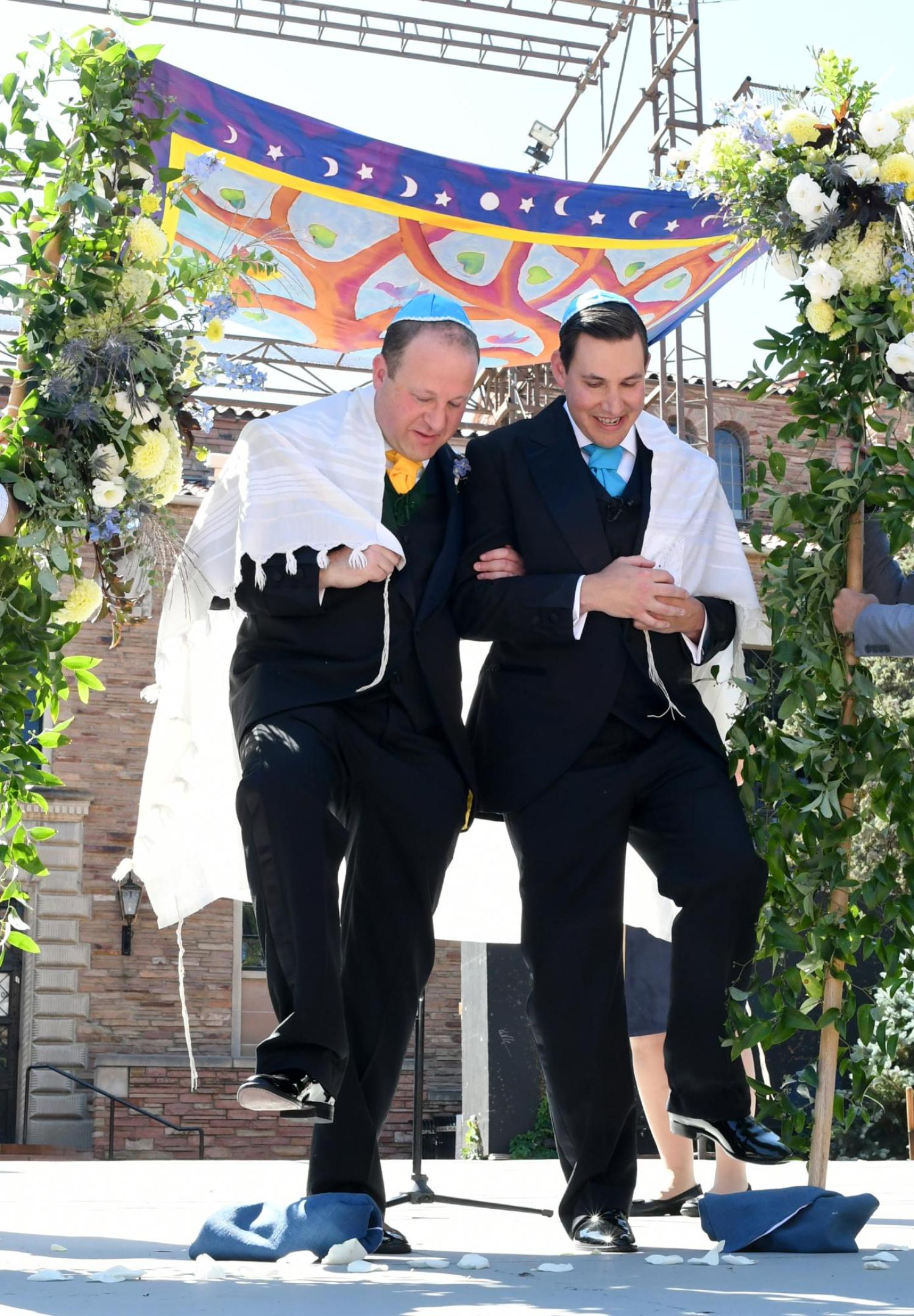 Newlyweds stomping glass