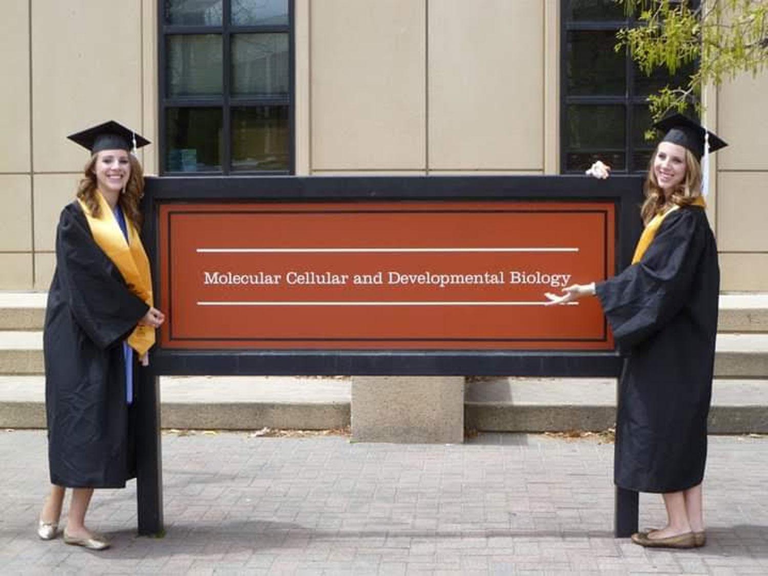 Cara and Amy Faliano MCDBio sign