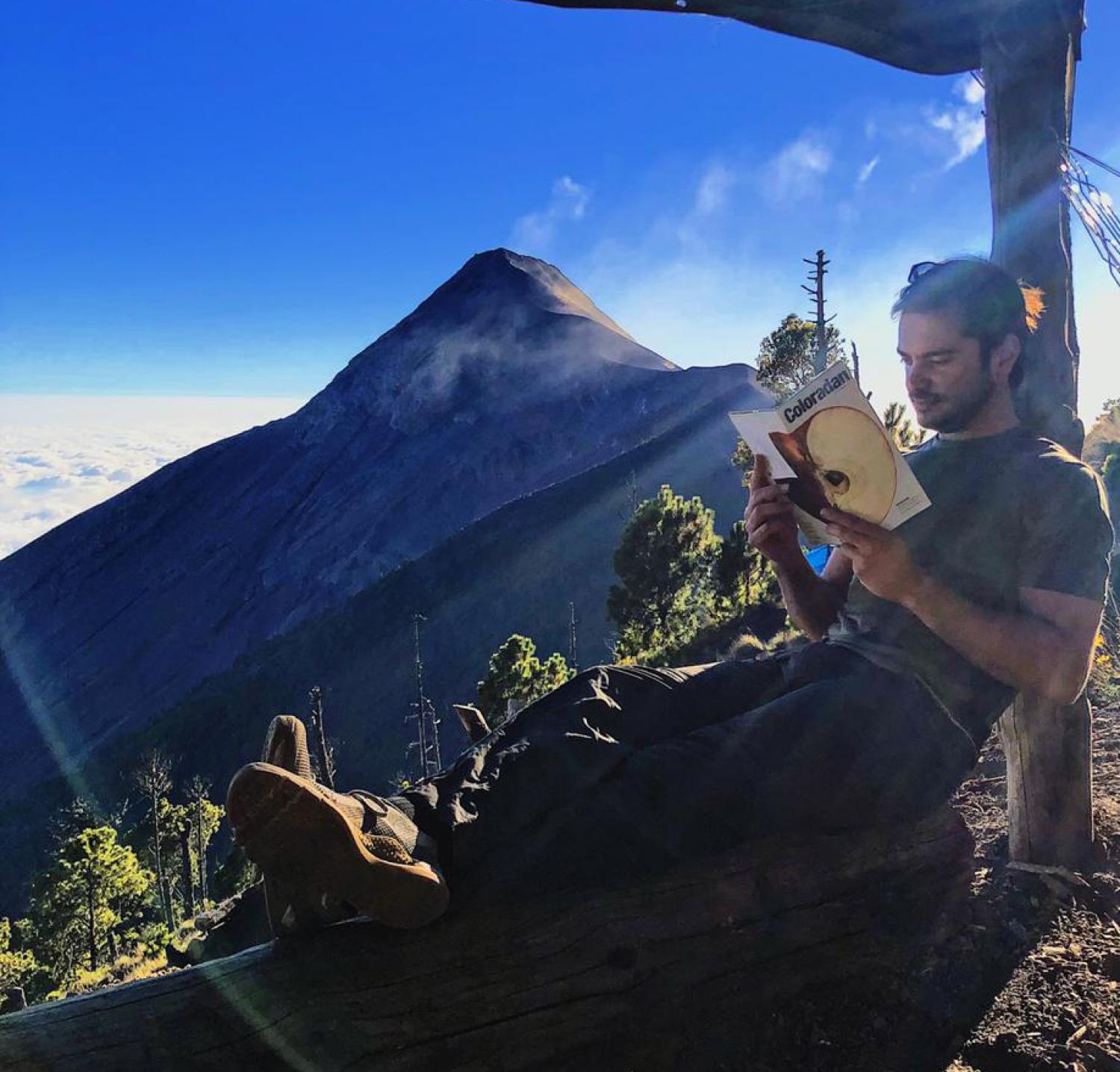 Paolo Estefania reading the Coloradan Magazine