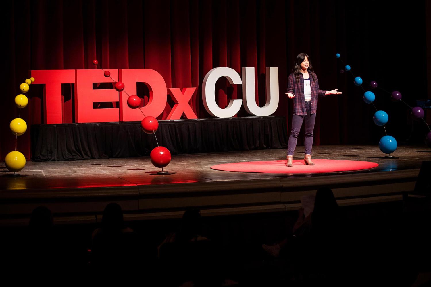 Nina Williams rehearses her presentation on the TEDxCU stage.