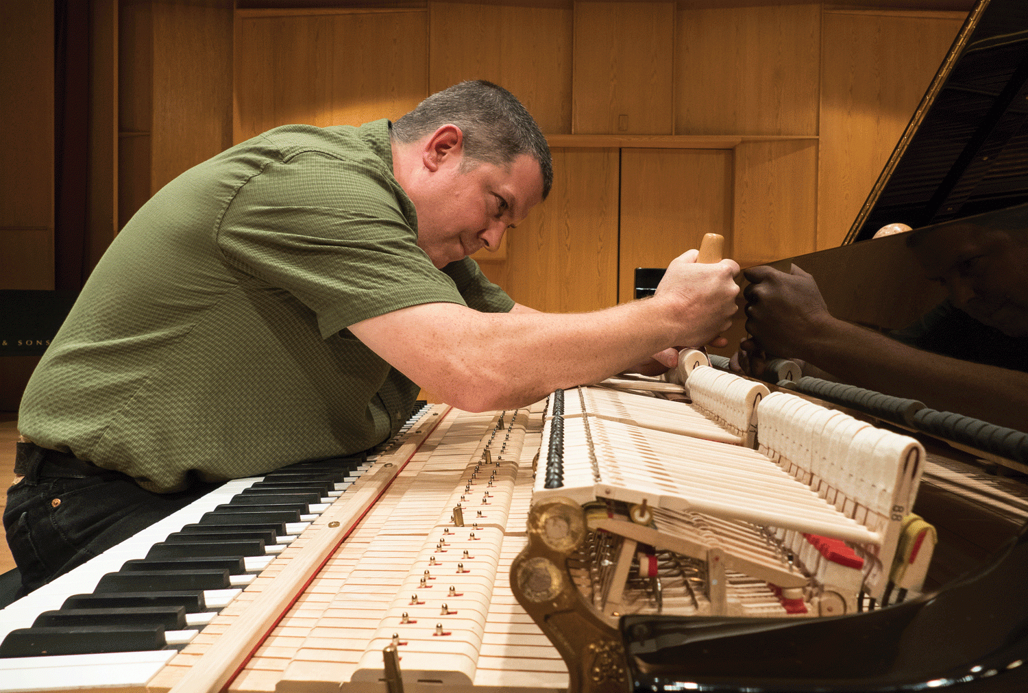 Ted Mulcahey tunes a CU piano