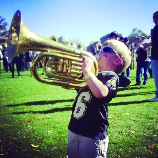 Child holding instrument