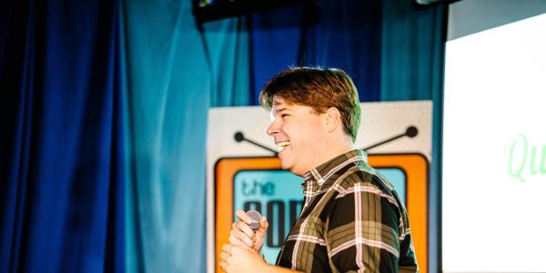 Brad Turner directing a live taping of a podcast 