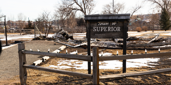 Town of Superior sign surrounded by environment impacted by the Marshall Fire