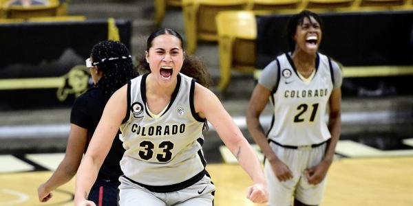 Buffs celebrate on the court after their win. 