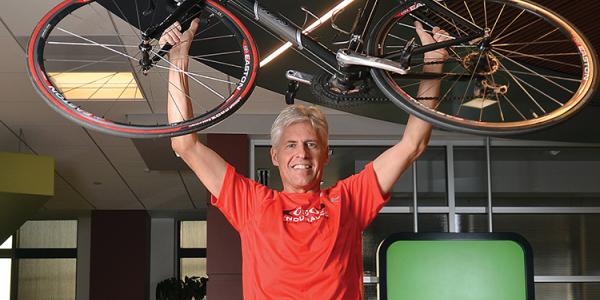 Dan King holding a bike