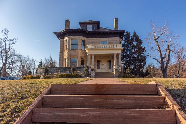 Exterior view from steps looking up to the Harbeck-Berheim House