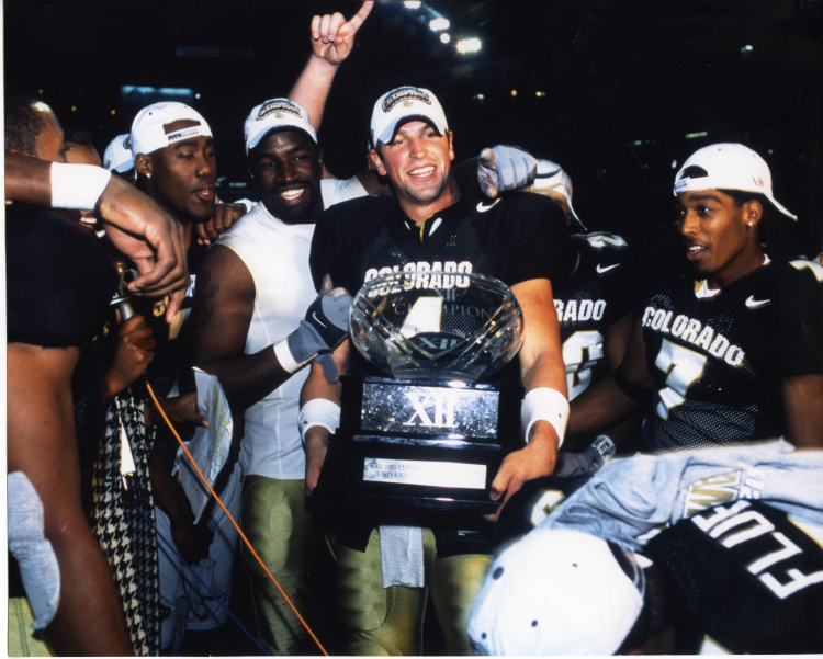 Bobby Pesavento holds the 2001 Big 12 Championship Trophy