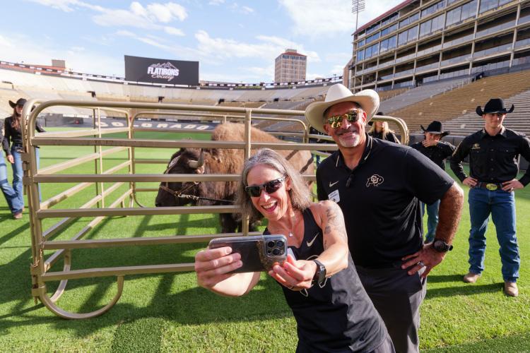 Chancellor Schwartz and spouse, Dr. Gina LaFrazza, meet Ralphie at a fundraising event.