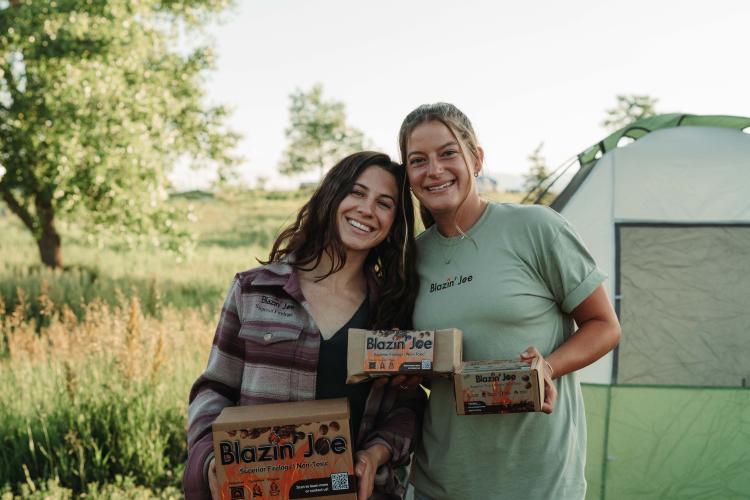 Maddie Cataldo and Maya Nefs with their Blazin' Joe firelogs