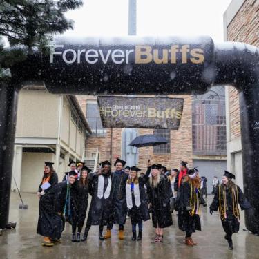 Graduates under forever buffs sign