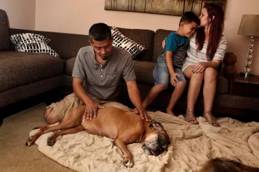 Family saying goodbye to pet dog