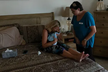 Owner craddling dog