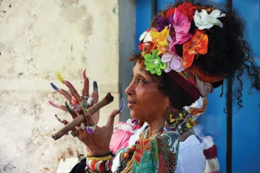Woman playing an instrument in Cuba