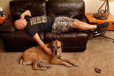 Owner laying with dog
