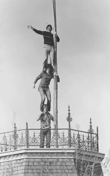 Old Main Flag Pole with Students