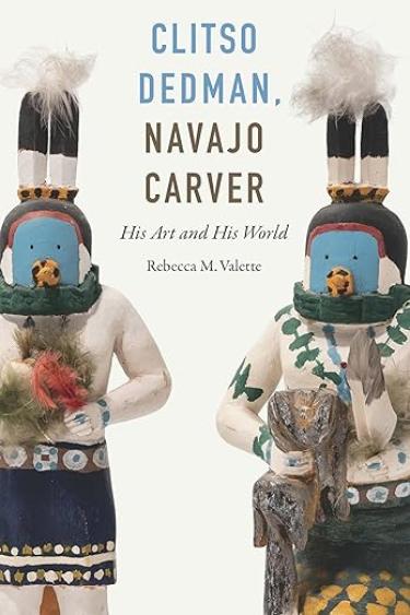 The cover is white with traditional Native American carvings featured.