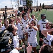 CU women's lacrosse team in a huddle