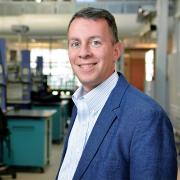 Bobby Braun poses for a photograph in his lab