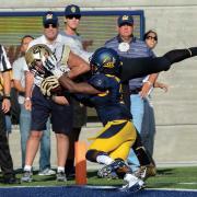 Nelson Spruce catching football