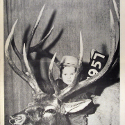 "The Cody Enterprise" magazine cover from 1954 showing a young boy with a deer carcass