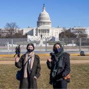 Students Zahra Abdulameer and Shay Mannik pose in front of the Capital building. 
