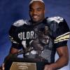 Rashaan Salaam holding the Heisman trophy