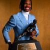 Travis Hunter holding the Heisman trophy