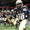 CU buffs football players run onto the field