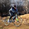 Allen Lim riding his bike on a trail