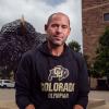 Andrew LeRoy in front of buffalo statue
