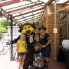 Chip with two kids and a woman at a tailgate party