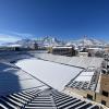 Snowy Folsom Field with Flatirons in the background