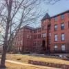 Perspective view of The Academy Nursing Home with sun shining through trees