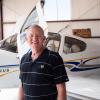 Portrait of Jim Voss in front of his airplanes