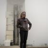 Laurie Cantillo in front of a rocket at NASA