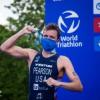 Morgan Pearson hold up his medal.