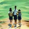 three young people standing in ankle-deep water