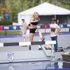 Val Constien jumps a hurdle.