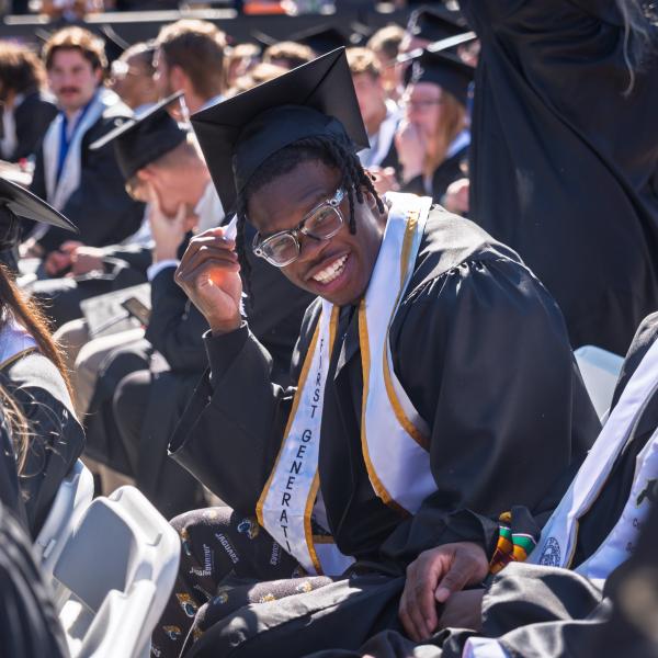 Travis Hunter posing for a picture at the commencement ceremony