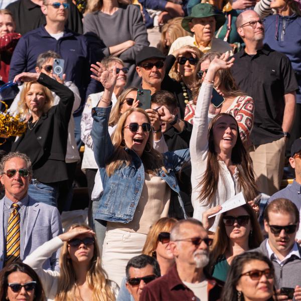 Guests cheering on their graduates at the commencement ceremony