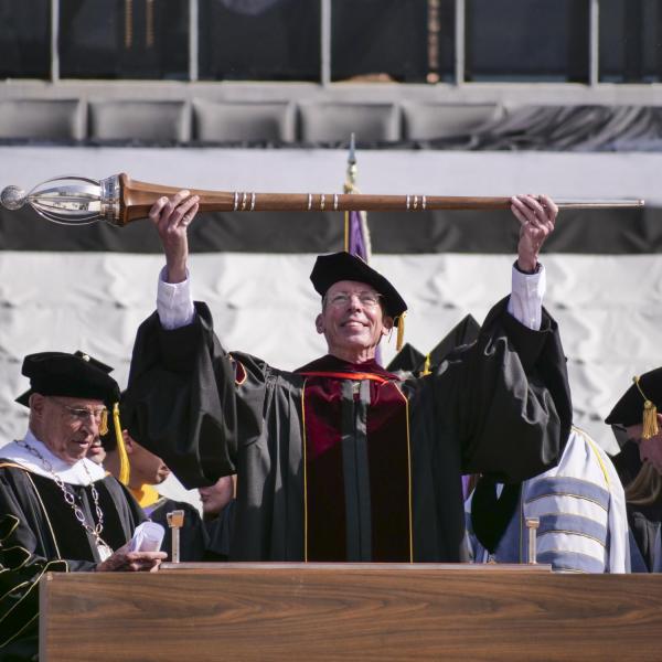 Marshal Bud Coleman holding up the mace