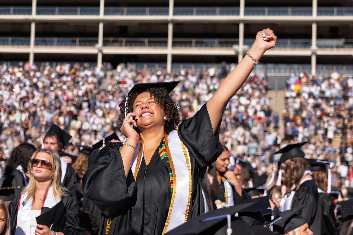 Student celebrating at the commencement ceremony