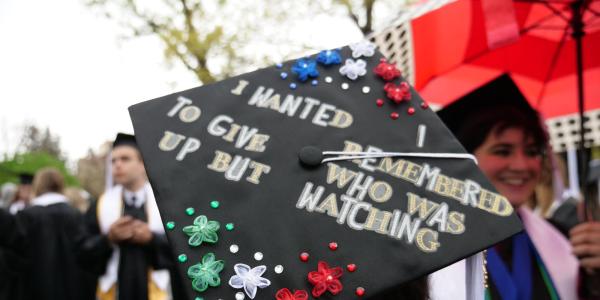 A cap that reads, "I wanted to give up but I remembered who's watching"