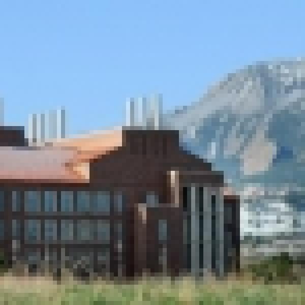 The Flatirons behind campus buildings