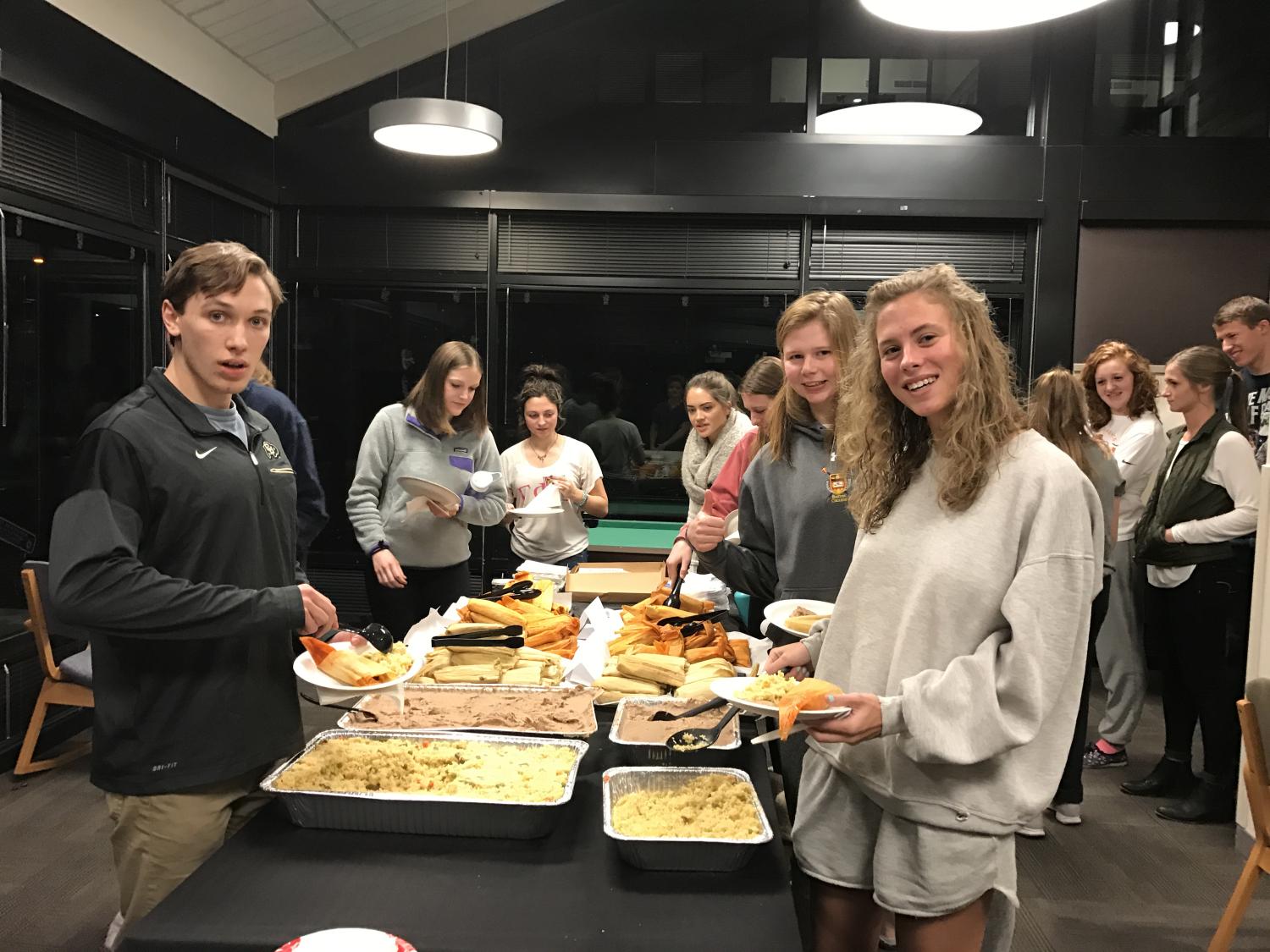 Students get food at the dinner