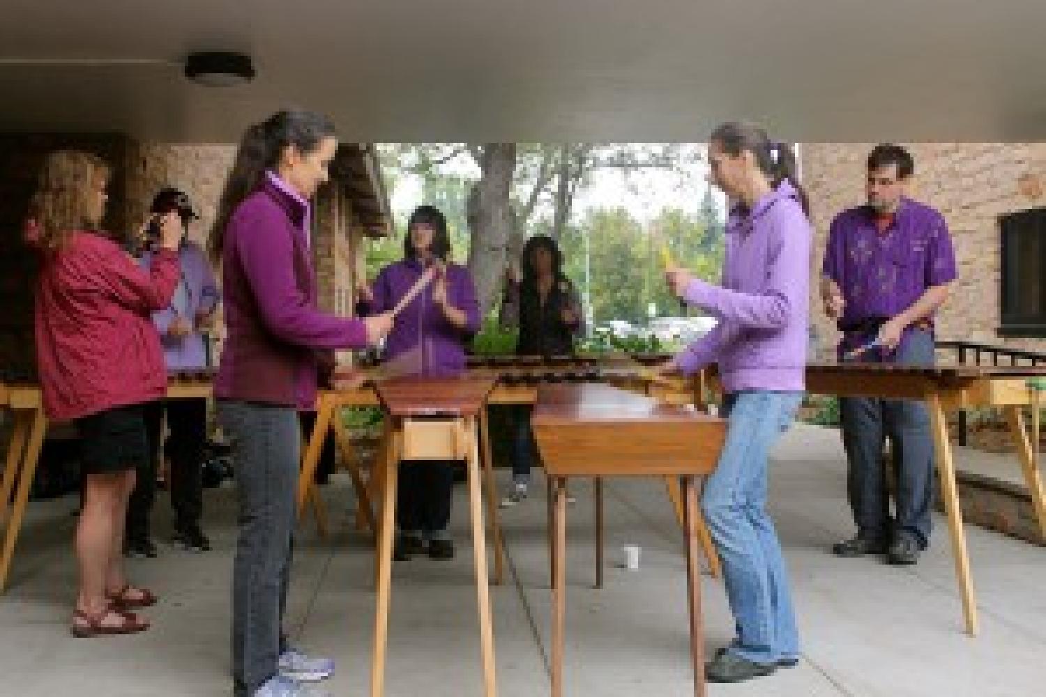 students play marimbas