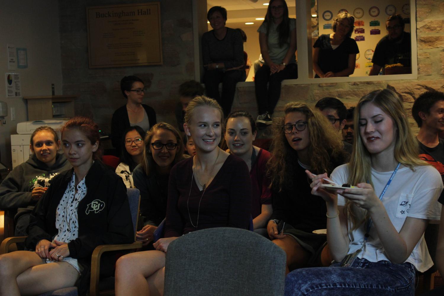Students watch their peers perform
