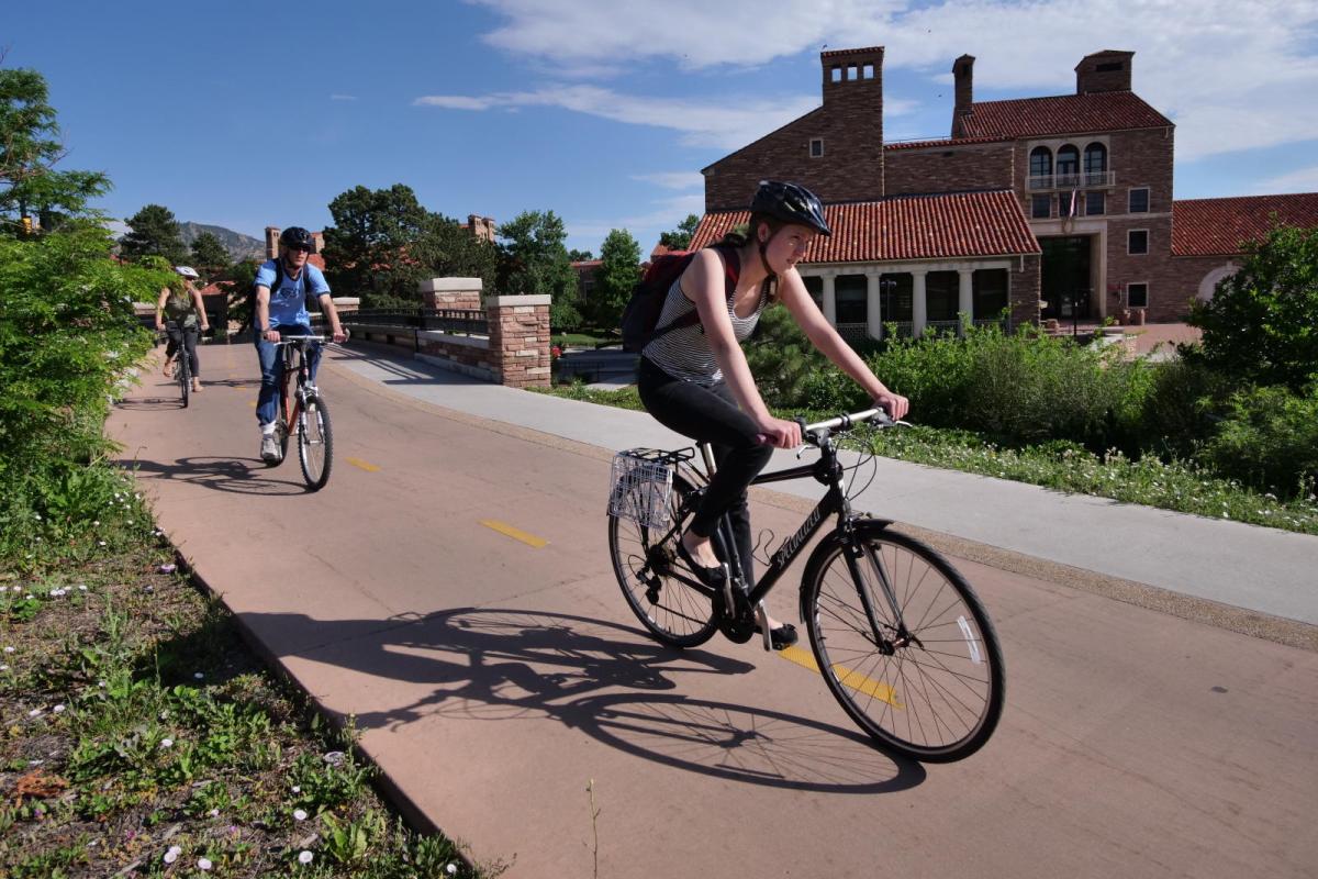 Student biking on campus