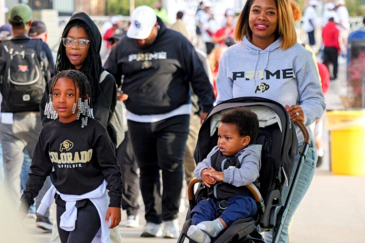 Family walking on campus